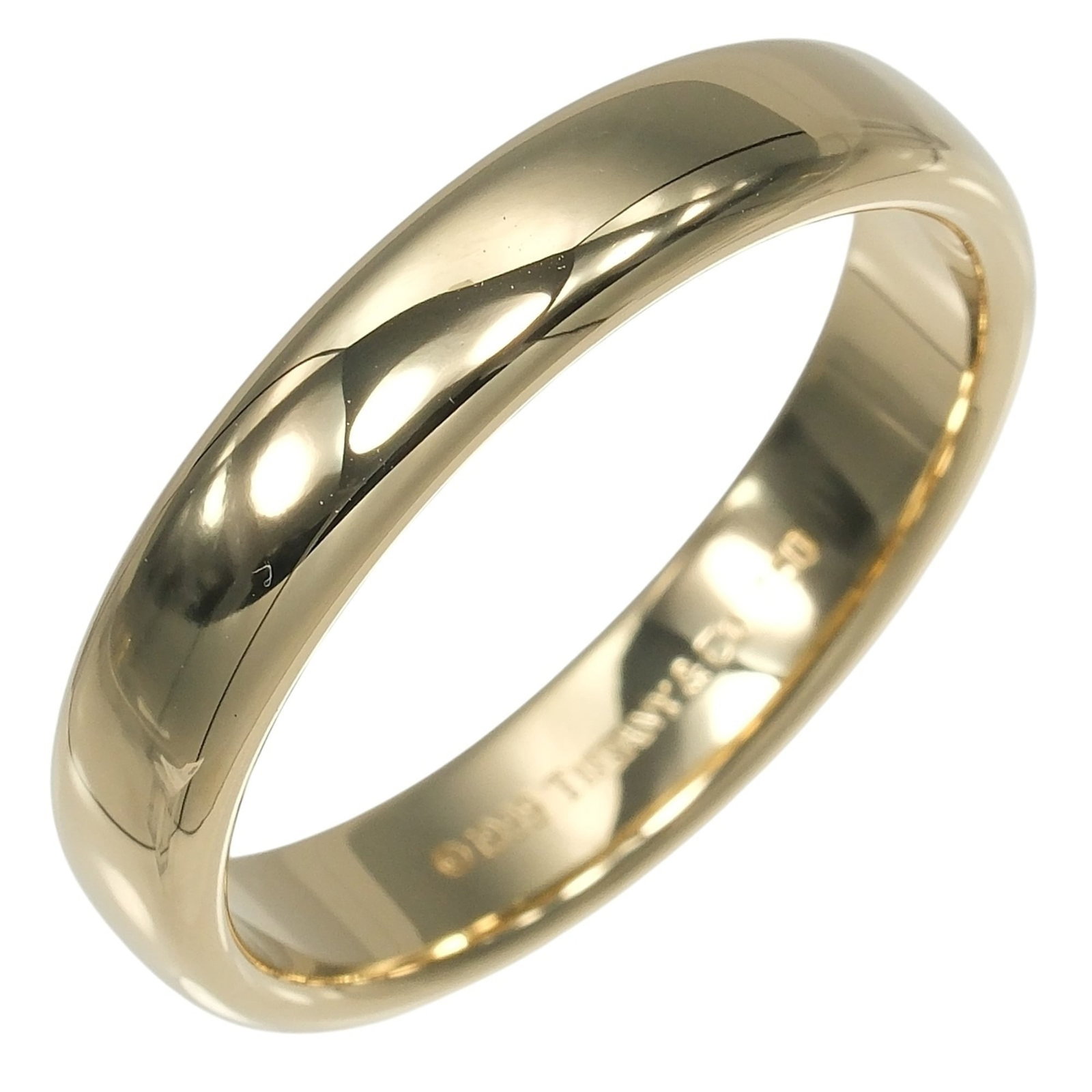 TIFFANY Band Ring Yellow Gold (18K): TIFFANY Band Ring Yellow Gold (18K) Yellow gold (18K) band ring from Tiffany, featuring a classic design. The item is in very good condition, with minor signs of wear and small scratches or light mark