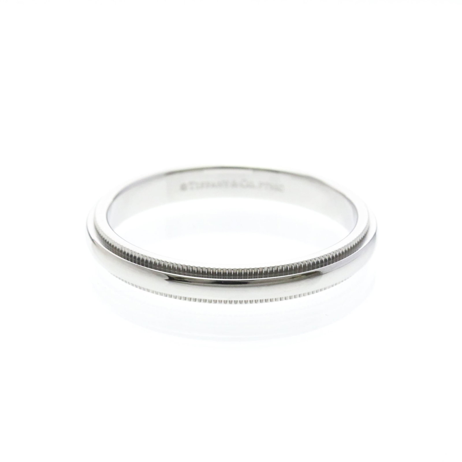 TIFFANY Band Ring Platinum: TIFFANY Band Ring Platinum Platinum band ring with a classic milgrain design, this timeless piece is crafted from sterling platinum metal. Measuring 3.2mm in width, it features a sleek and slender