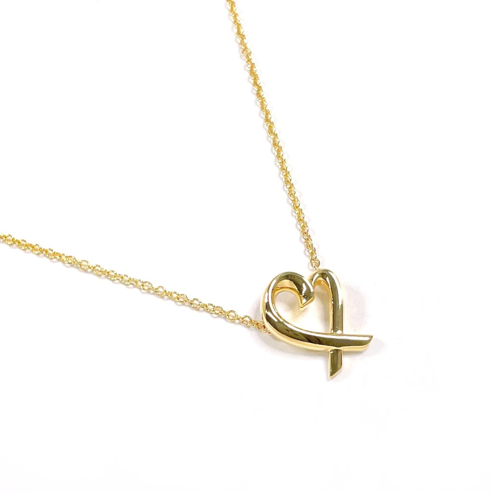 TIFFANY Yellow Gold (18K): TIFFANY Yellow Gold (18K) Yellow gold (18K) necklace with a pendant bearing a signature, crafted by Tiffany. This 41 cm (16.14'') necklace features a 11.4mm x 8.8mm pendant, made from 18K yellow