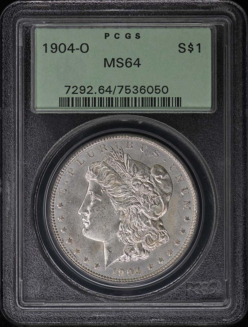 MORGAN DOLLAR 1904 O PCGS MS64 OGH: MORGAN DOLLAR 1904 O PCGS MS64 OGH The 1904 Morgan Dollar is a rare and highly sought-after coin, graded MS64 by the PCGS. Certified as uncirculated, this coin boasts a stunning condition, with its or