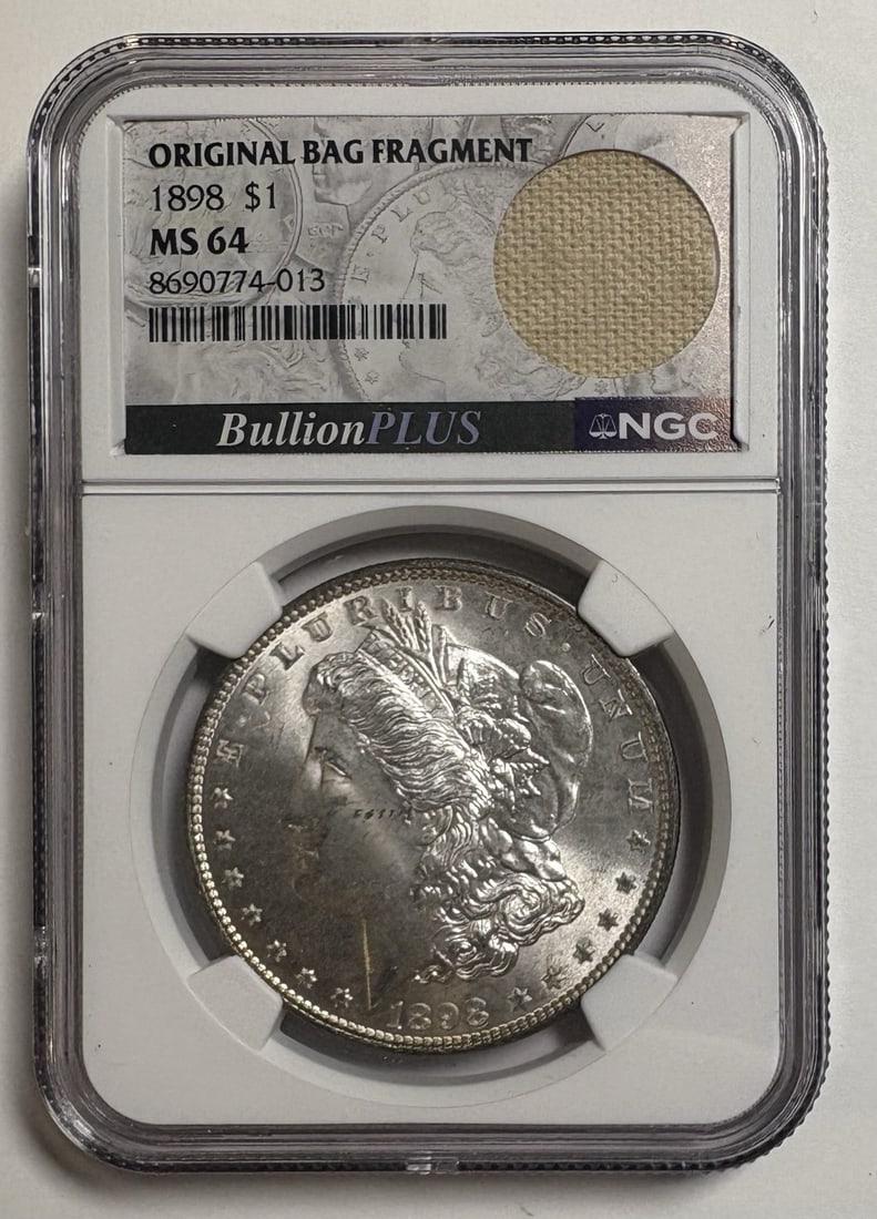 1898 MORGAN DOLLAR NGC MS64 ORIGINAL BAG FRAGMENT: 1898 MORGAN DOLLAR NGC MS64 ORIGINAL BAG FRAGMENT The 1898 Morgan dollar is a classic design, and this NGC MS64 original bag fragment is a rare piece of numismatic history. With its silver