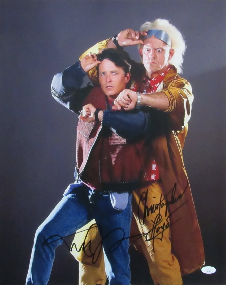 Michael J Fox Christopher Lloyd Auto Sign Photo Future Back 174010: Michael J Fox Christopher Lloyd Auto Sign Photo Future Back 174010 This is a photo signed by Michael J. Fox and Christopher Lloyd, both iconic stars of the "Back to the Future" trilogy. The item featu