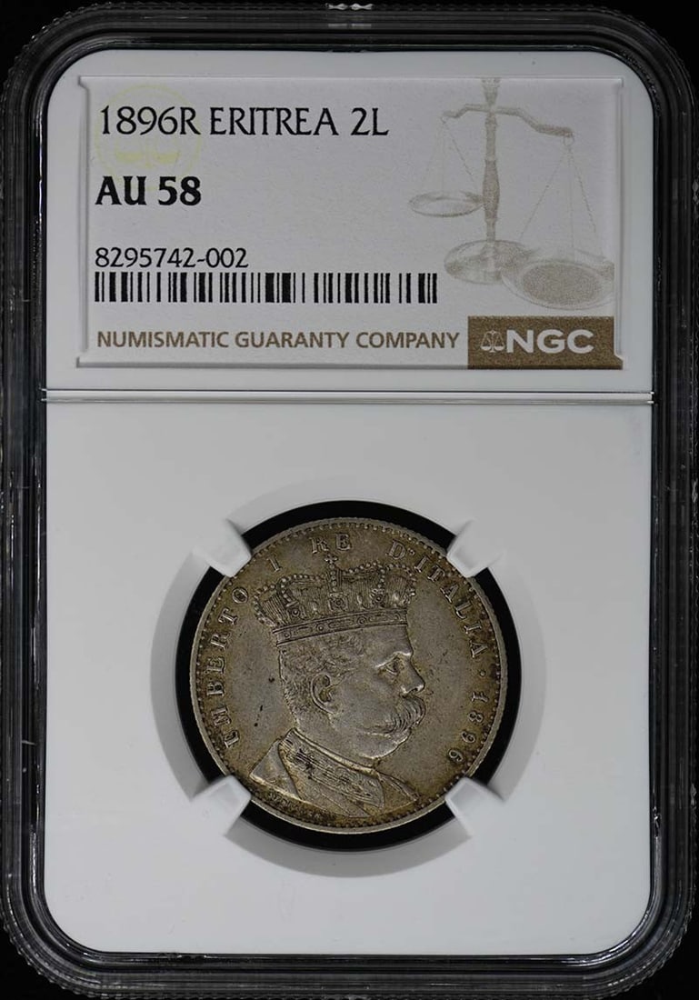 1896R ERITREA UMBERTO Silver 2 Lire NGC AU58: 1896R ERITREA UMBERTO Silver 2 Lire NGC AU58 1896R ERITREA UMBERTO Silver 2 Lire NGC AU58 - A circulated 2 Lire coin from 1896, graded AU58 by the Numismatic Guaranty Corporation, showcasing its worn 