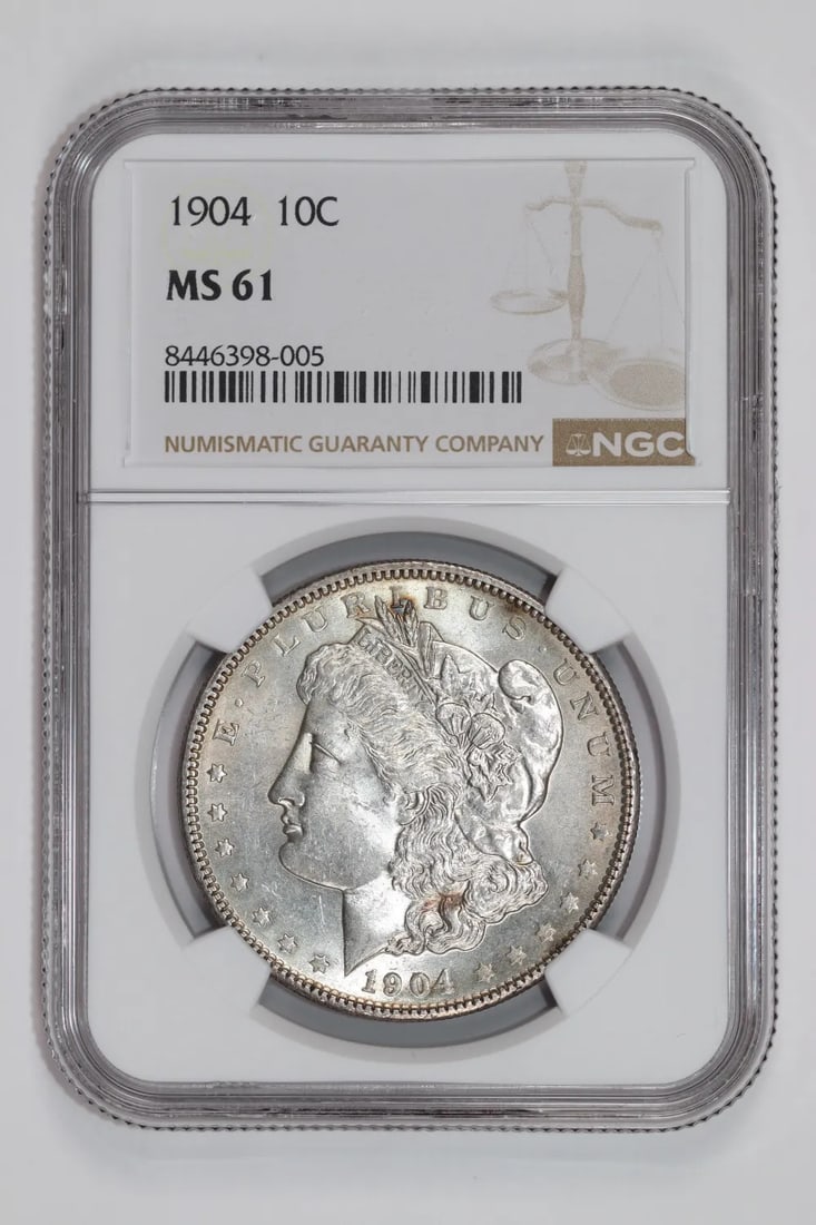 MORGAN DOLLAR 1904 MS61 NGC: MORGAN DOLLAR 1904 MS61 NGC The 1904 Morgan Dollar MS61 NGC is a highly detailed and well-crafted coin, graded by the Numismatic Guaranty Corporation (NGC) for its exceptional condition. This uncircul