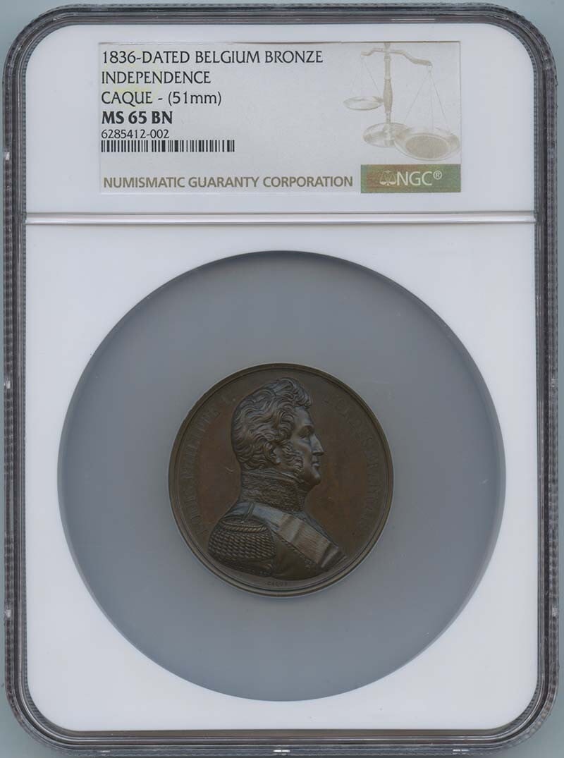 1836 Dated Belgium Independence Bronze Medal CAQUE 51mm NGC MS65: 1836 Dated Belgium Independence Bronze Medal CAQUE 51mm NGC MS65 This 1836 Dated Belgium Independence Bronze Medal is a rare and historic artifact, bearing the CAQUE designation and graded MS65 by the