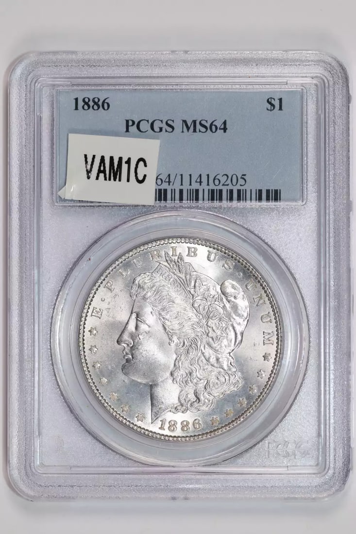 CLASHED REVERSE HOT 50 MORGAN DOLLAR 1886 VAM-1C PCGS MS64: CLASHED REVERSE HOT 50 MORGAN DOLLAR 1886 VAM-1C PCGS MS64 The 1886 VAM-1C Morgan Dollar, graded MS64 by PCGS, is a highly detailed and well-preserved example of this iconic coin. With its unique char