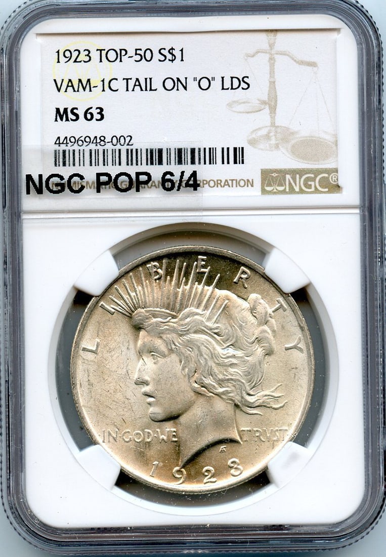 C9453- 1923 VAM-1C TAIL ON "O" LDS TOP 50 PEACE DOLLAR NGC MS63 - NGC POP 6/ 4: C9453- 1923 VAM-1C TAIL ON "O" LDS TOP 50 PEACE DOLLAR NGC MS63 - NGC POP 6/ 4 This 1923 VAM-1C "O" LDS Peace Dollar is a highly sought-after collector's item, featuring a unique tail on the "O" in th