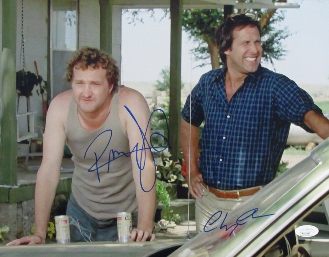 Chevy Chase/ Randy Quaid Dual-Autographed 11x14 Photo "Vacation" JSA: Chevy Chase/ Randy Quaid Dual-Autographed 11x14 Photo "Vacation" JSA Chevy Chase and Randy Quaid's iconic on-screen chemistry is captured in this dual-autographed 11x14 photo from the classic 1983 com