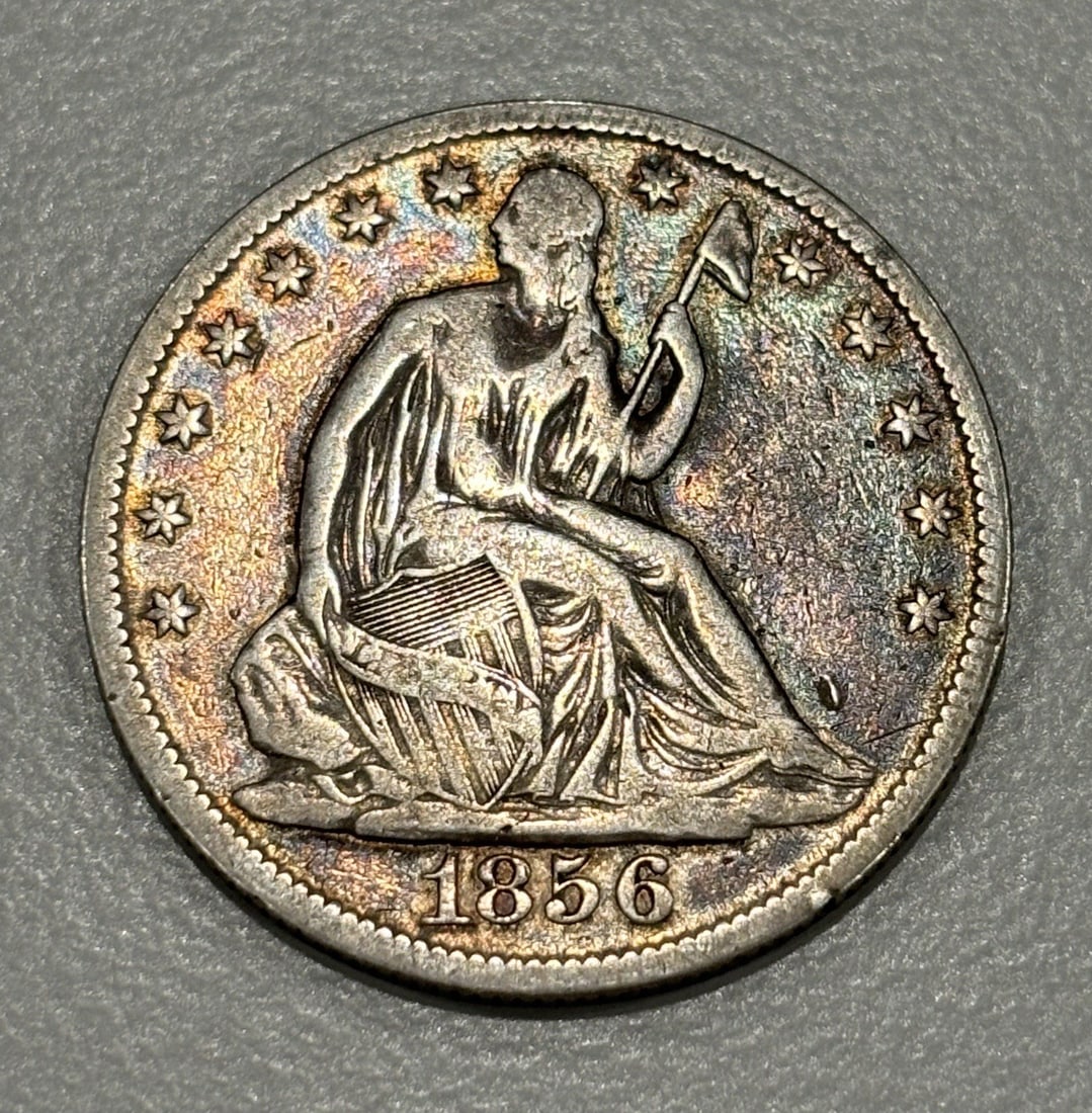 1856-O SEATED HALF DOLLAR XF DETAILS: 1856-O SEATED HALF DOLLAR XF DETAILS XF DETAILS 1856-O SEATED HALF DOLLAR - A Circulated 50C Coin from the 1856 New Orleans Mint, featuring Seated Liberty on the reverse and a detailed design on the o