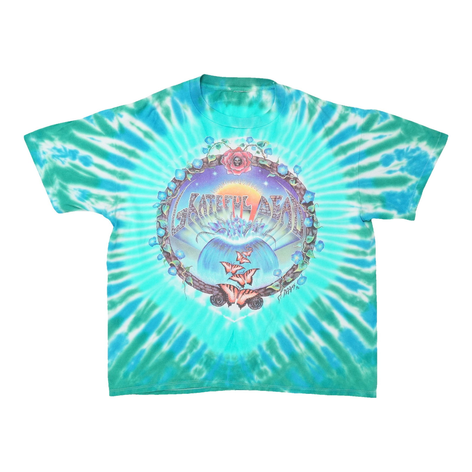 Dead Grateful 1992 Spring Tour Shirt Tie Dye: Dead Grateful 1992 Spring Tour Shirt Tie Dye Dead Grateful's 1992 Spring Tour Shirt is a vibrant tie-dye masterpiece, featuring the band's iconic psychedelic print. This rare tour tee is a must-have f