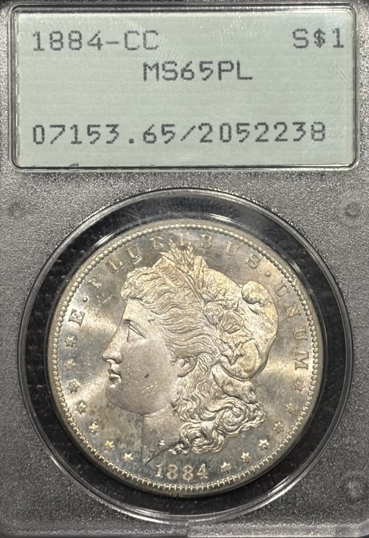 MS65 PCGS OGH 1884 CC MORGAN DOLLAR PL RATTLER: MS65 PCGS OGH 1884 CC MORGAN DOLLAR PL RATTLER MS65 PCGS OGH 1884 CC MORGAN DOLLAR PL RATTLER is a highly graded, uncirculated 1884 Morgan dollar with a PCGS MS 65 grade, indicating exceptional condit