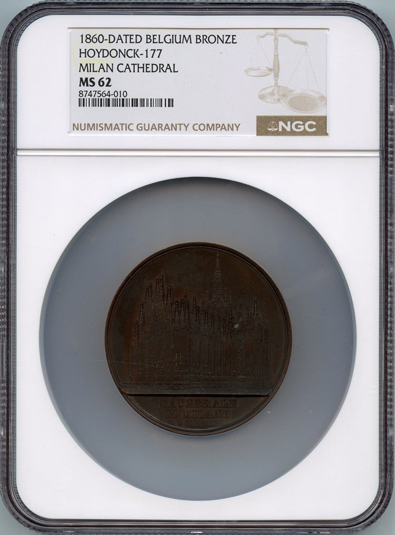 BRONZE NGC MS62 177 MILAN CATHEDRAL HOYDONCK 1860-DATED BELGIUM: BRONZE NGC MS62 177 MILAN CATHEDRAL HOYDONCK 1860-DATED BELGIUM MS62 graded by NGC, this 1860-Dated Belgian coin features a striking design of the Milan Cathedral in Hoydonck, showcasing its