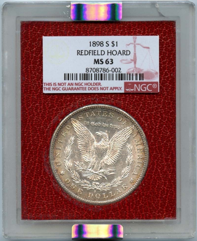 REDFIELD HOARD MORGAN DOLLAR $1 1898 NGC MS63: REDFIELD HOARD MORGAN DOLLAR $1 1898 NGC MS63 The 1898 Redfield Morgan Dollar is a highly detailed and intricately designed coin, featuring the iconic portrait of Lady Liberty on the obverse and the i