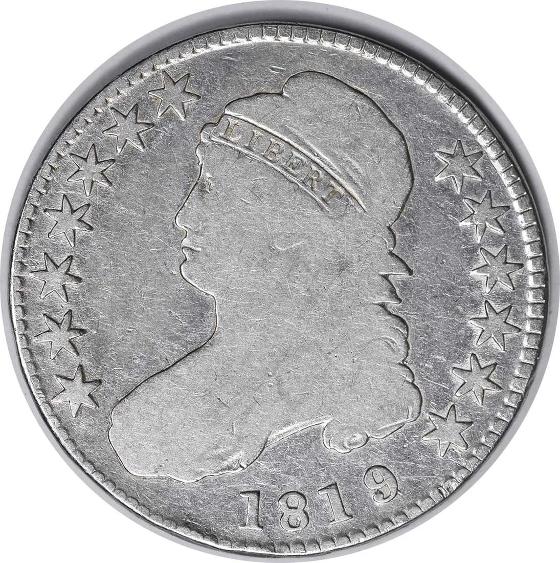 Silver Half Dollar 1819/ 8 O-103 F Uncertified Bust: Silver Half Dollar 1819/ 8 O-103 F Uncertified Bust The 1819/8 O-103 F Uncertified Bust Silver Half Dollar boasts a unique blend of historical significance and numismatic charm. This circulated coin f