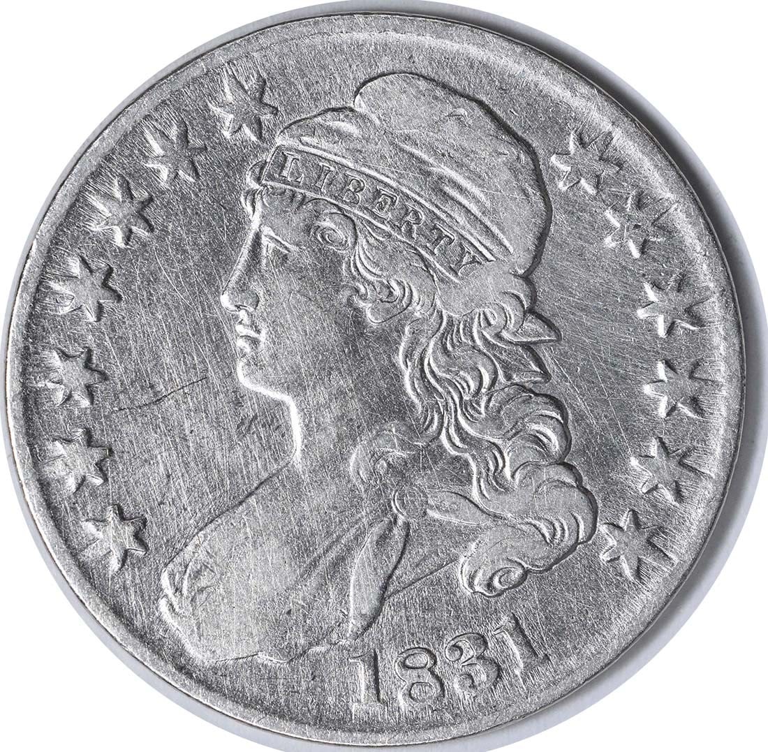 Half Dollar 1831 Bust EF Uncertified: Half Dollar 1831 Bust EF Uncertified The 1831 Bust Half Dollar is a rare and historic coin, featuring John Reich's design and a distinctive bust profile on the obverse. Made from 89.2% silver and 10.8