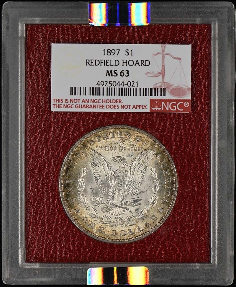 1897 MORGAN DOLLAR REDFIELD HOARD $1 NGC MS63: 1897 MORGAN DOLLAR REDFIELD HOARD $1 NGC MS63 The 1897 Morgan Dollar features a striking design by Charles E. Barber, with its classic eagle and shield motifs. This NGC MS63 certified coin is a high-q