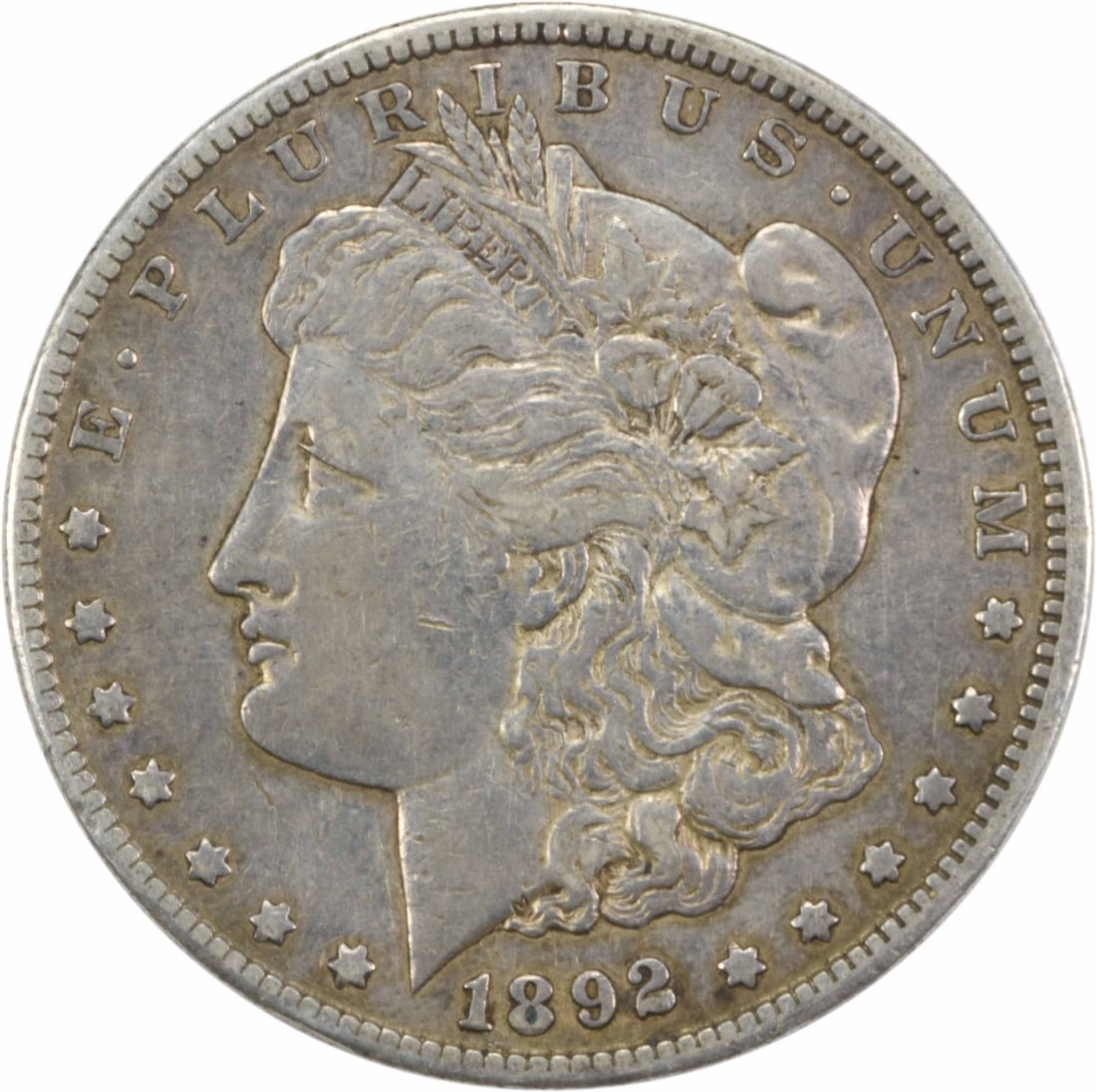 Silver Dollar Choice VF Uncertified 1892-CC Morgan: Silver Dollar Choice VF Uncertified 1892-CC Morgan The 1892-CC Morgan Dollar is a striking example of early American coinage, featuring a reeded edge and a distinctive CC mint mark. With its 90% silve
