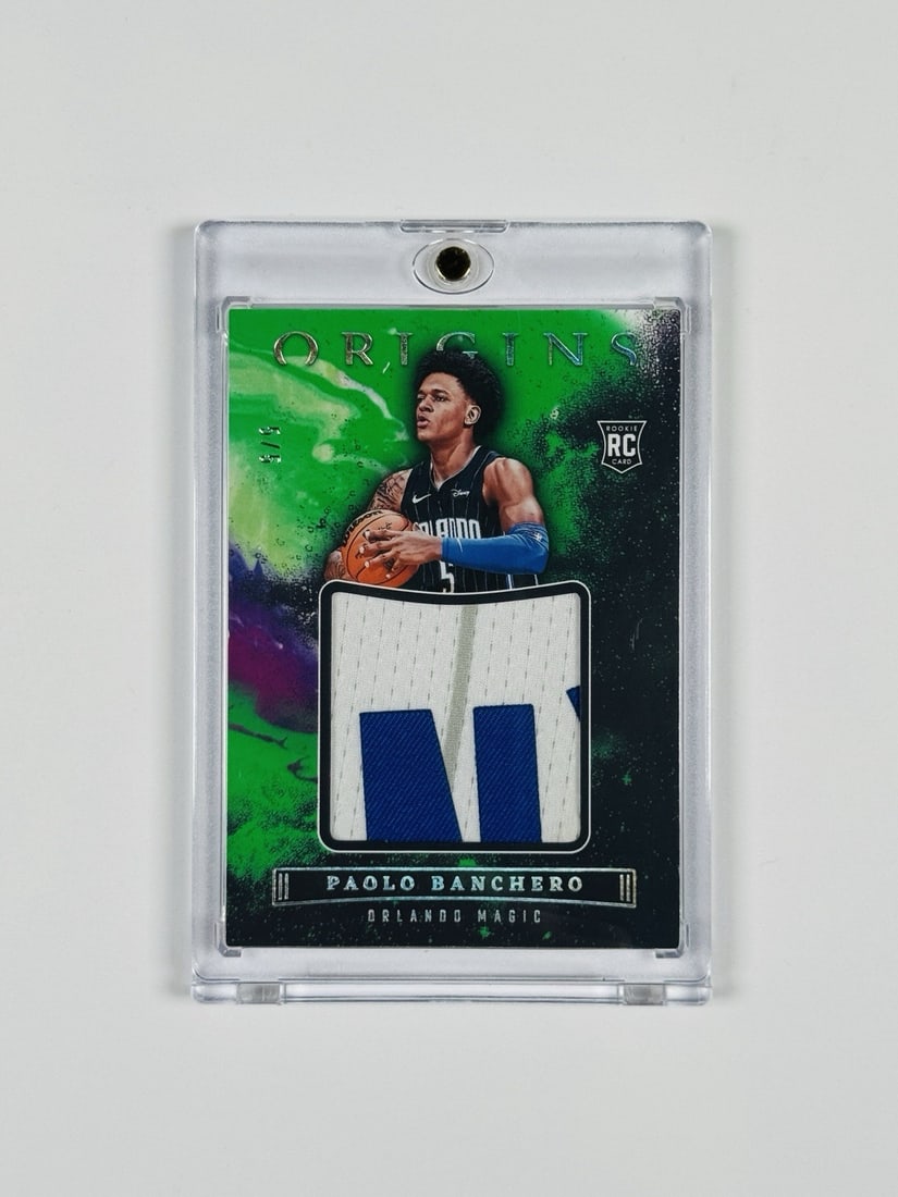 2022-23 PANINI ORIGINS PAOLO BANCHERO ROOKIE PATCH 5/ 5 JERSEY MATCH: 2022-23 PANINI ORIGINS PAOLO BANCHERO ROOKIE PATCH 5/ 5 JERSEY MATCH Paolo Banchero Rookie Patch 5/5 Jersey Match: A highly sought-after 2022-23 Panini Origins card featuring the Orlando Magic's top p