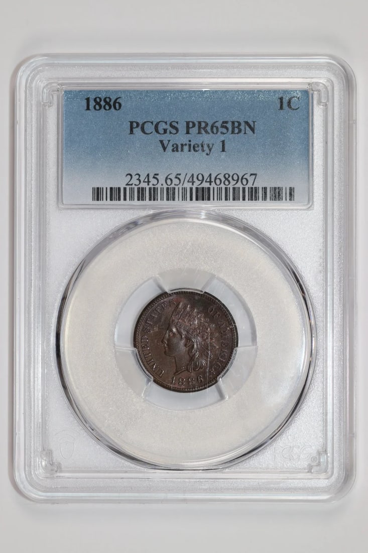 TYPE 1 1886 INDIAN CENT PCGS PROOF PR65 BN: TYPE 1 1886 INDIAN CENT PCGS PROOF PR65 BN PCGS Proof PR65, this 1886 Indian Cent is a highly detailed proof coin featuring a striking design. Certified by the Professional Coin Grading Service (PCGS)