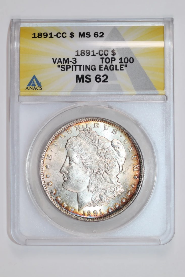 1891-CC VAM-3 SPITTING EAGLE MORGAN DOLLAR ANACS MS62: 1891-CC VAM-3 SPITTING EAGLE MORGAN DOLLAR ANACS MS62 The 1891-CC VAM-3 Spitting Eagle Morgan Dollar is a highly detailed and ornate coin, featuring a unique design element known as the "Spitting Eagl