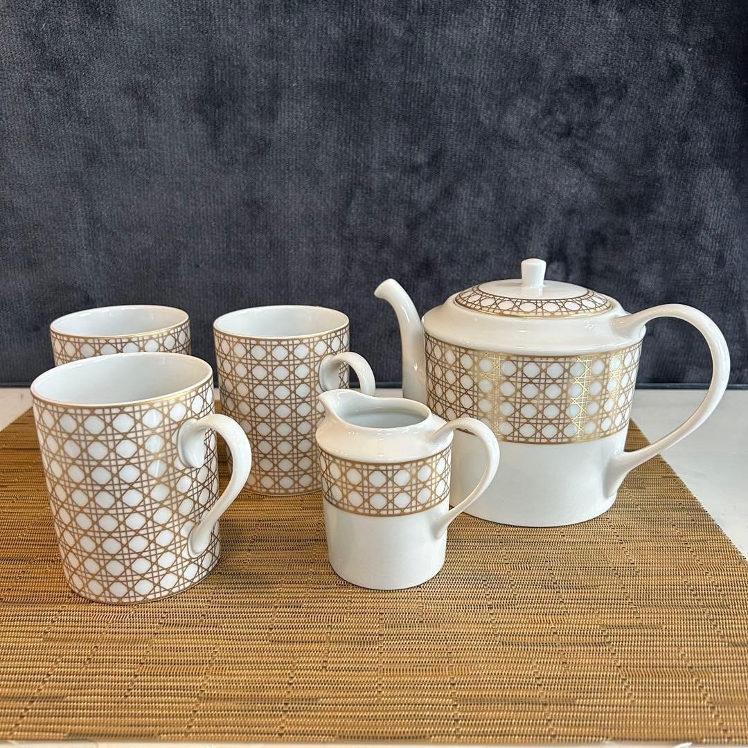 Dior Canage Montaigne tea set Teapot and 3 mug cups and creamer 5-Piece set: Dior Canage Montaigne tea set Teapot and 3 mug cups and creamer 5-Piece set Item Specifics: Convention/Event: NA Number Of Items In Set: NA Shape: NA Keeps Cold For: NA Occasion: NA Size: NA Vintage: