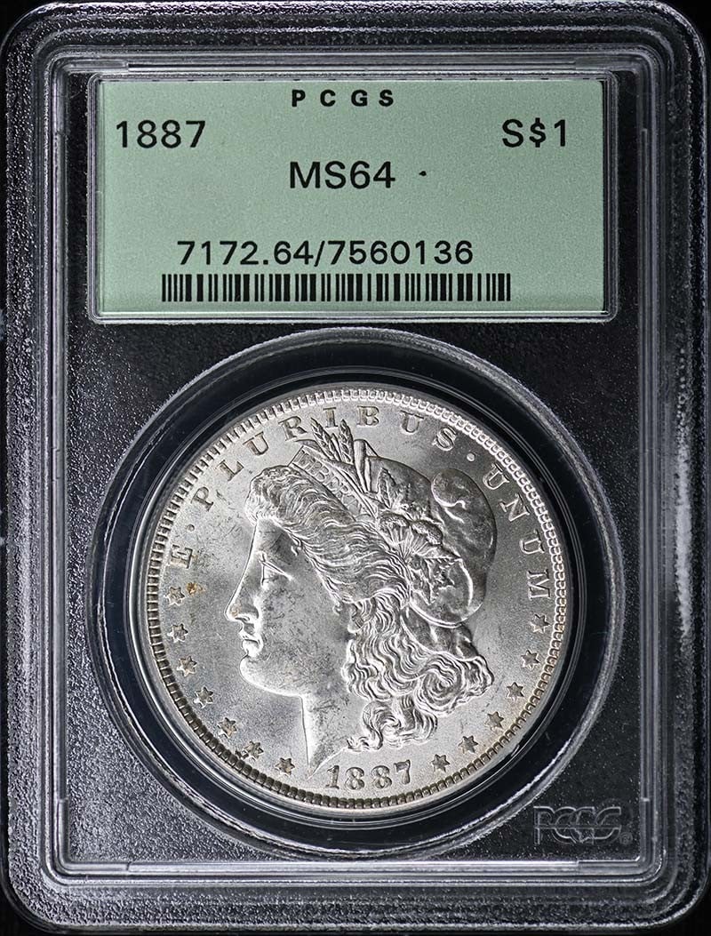 1887 $1 Morgan Dollar PCGS MS64: 1887 $1 Morgan Dollar PCGS MS64 The 1887 $1 Morgan Dollar is a highly detailed and intricately designed coin, featuring an obverse by Victor David Brenner and a reverse by George T. Morgan. Graded