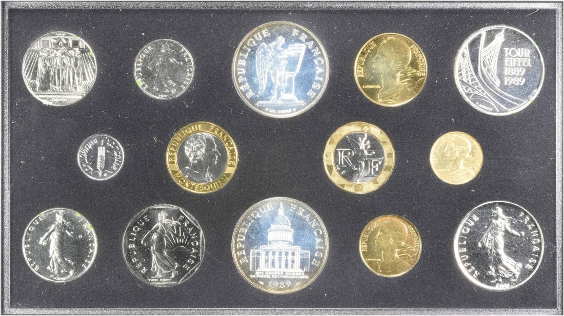1989 France Specimen BU Set KMSS27 (14 Coins): 1989 France Specimen BU Set KMSS27 (14 Coins) The 1989 France Specimen BU Set KMSS27 is a 14-coin collection featuring the American Eagle, with each coin boasting 1 oz of precious metal content. Certi