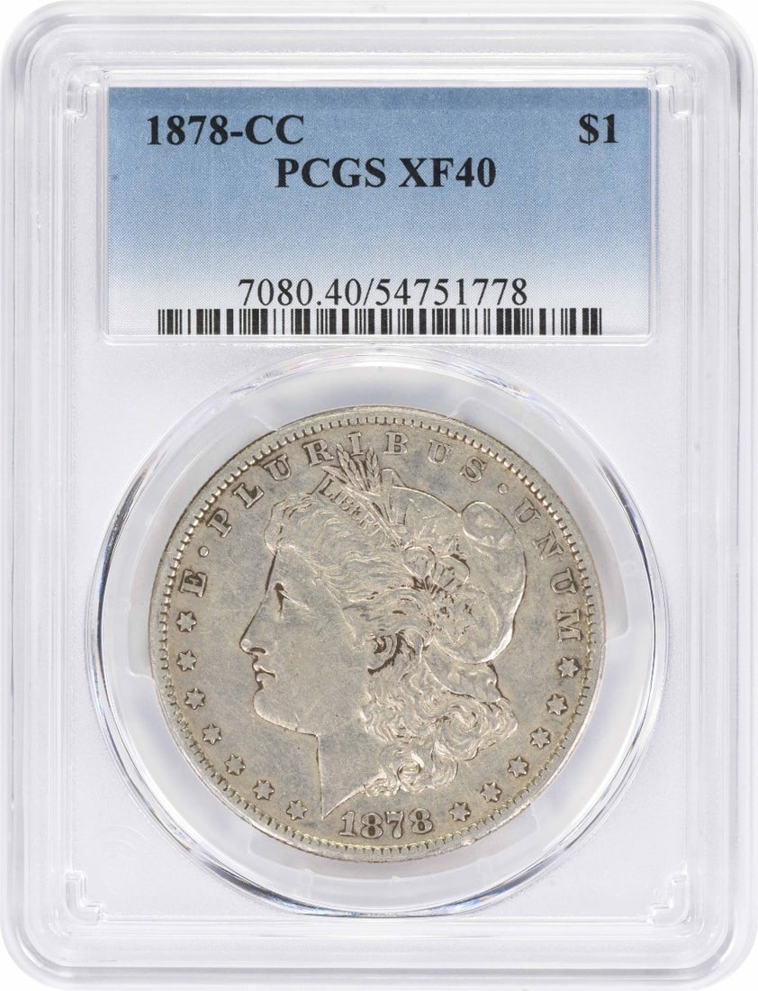1878-CC Morgan Silver Dollar EF40 PCGS: 1878-CC Morgan Silver Dollar EF40 PCGS The 1878-CC Morgan Silver Dollar is a highly detailed and intricately designed coin, featuring a reeded edge and a diameter of 38.10 millimeters. Certified by