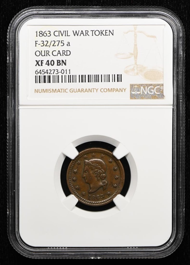WAR F-32 275 NGC XF40BN TOKEN 1863 CIVIL: WAR F-32 275 NGC XF40BN TOKEN 1863 CIVIL The 1863 WAR F-32 token is a circulated example graded XF40BN by the NGC, featuring a notable BN (brown) tone on the reverse. This token bears a signature, tho