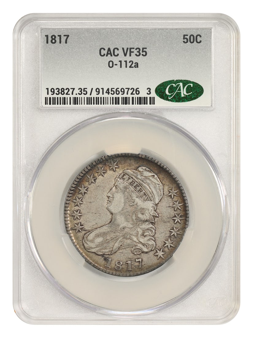 1817 50C CACG VF35 (O-112a) - Capped Bust Half Dollar: 1817 50C CACG VF35 (O-112a) - Capped Bust Half Dollar The 1817 50C CACG VF35 (O-112a) Capped Bust Half Dollar is a circulated example of this iconic coin, bearing the distinctive CACG certification nu