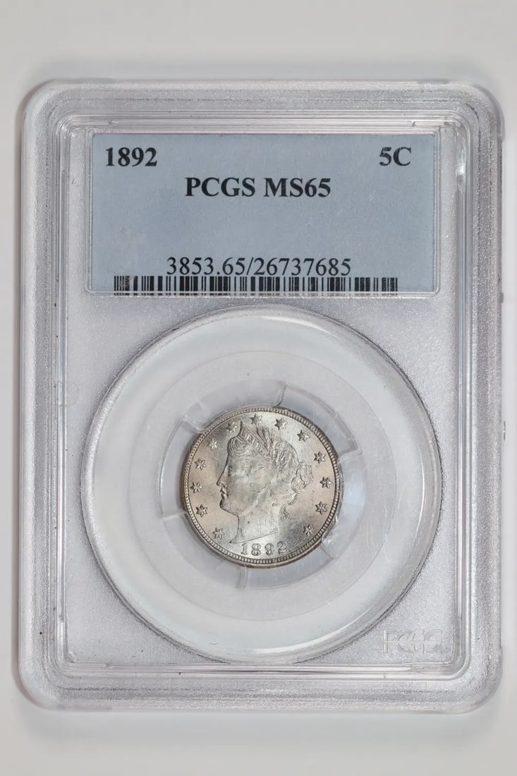 V Liberty Nickel PCGS MS65: V Liberty Nickel PCGS MS65 The 1892 V Liberty Nickel, graded MS65 by PCGS, is a highly detailed and well-preserved example of a circulated coin. Its uncirculated condition and high grade make it a not