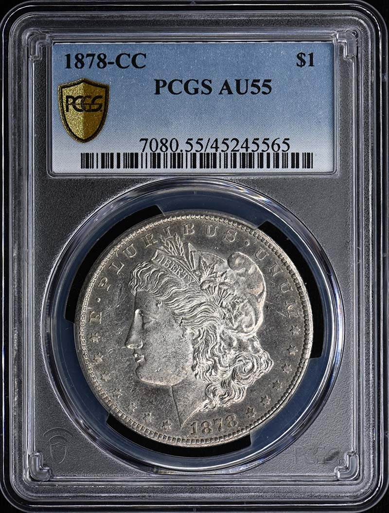 Morgan Dollar 1878 CC AU55 PCGS: Morgan Dollar 1878 CC AU55 PCGS The 1878 Morgan Dollar CC is a circulated example, graded AU55 by PCGS, showcasing its worn yet still distinct details. This coin bears the mark of its Carson City