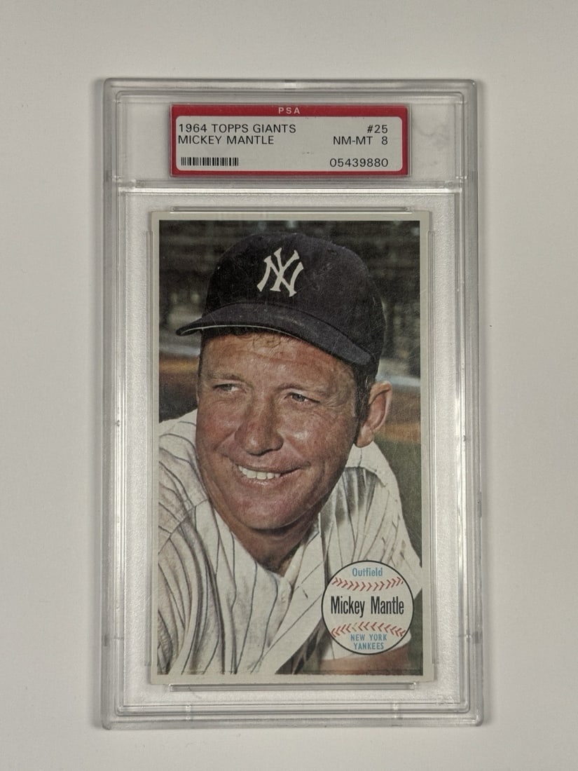 1964 TOPPS GIANTS MICKEY MANTLE #25 PSA 8: 1964 TOPPS GIANTS MICKEY MANTLE #25 PSA 8 The 1964 Topps Giants Mickey Mantle #25 is a highly graded PSA 8 card, showcasing the iconic baseball player in his prime. This card is a rare and significant