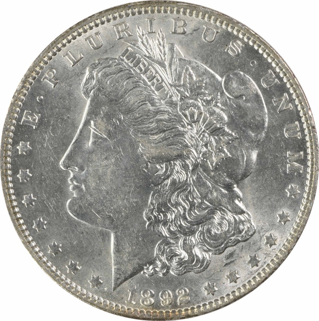 Slider Uncertified Morgan Dollar 1892 AU: Slider Uncertified Morgan Dollar 1892 AU The 1892 Uncertified Morgan Dollar is a circulated coin with a rich history, featuring George T. Morgan's iconic design and a striking reeded edge. Made from 9