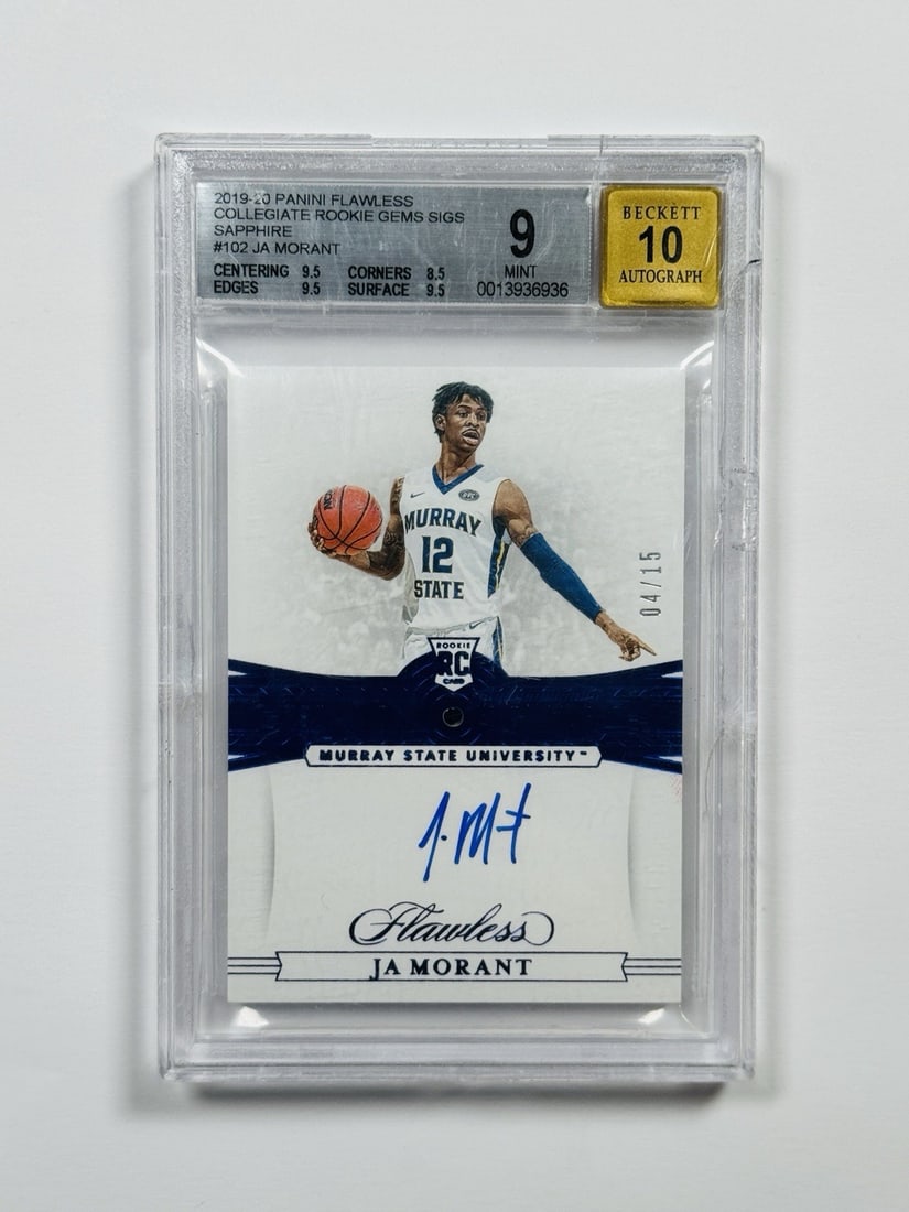 2019-20 PANINI FLAWLESS COLLEGIATE JA MORANT #102 SAPPHIRE ROOKIE AUTO/ 15: 2019-20 PANINI FLAWLESS COLLEGIATE JA MORANT #102 SAPPHIRE ROOKIE AUTO/ 15 Sapphire Rookie Auto #102 is a unique, hard-signed print featuring Ja Morant's autograph in a standard size card. With a