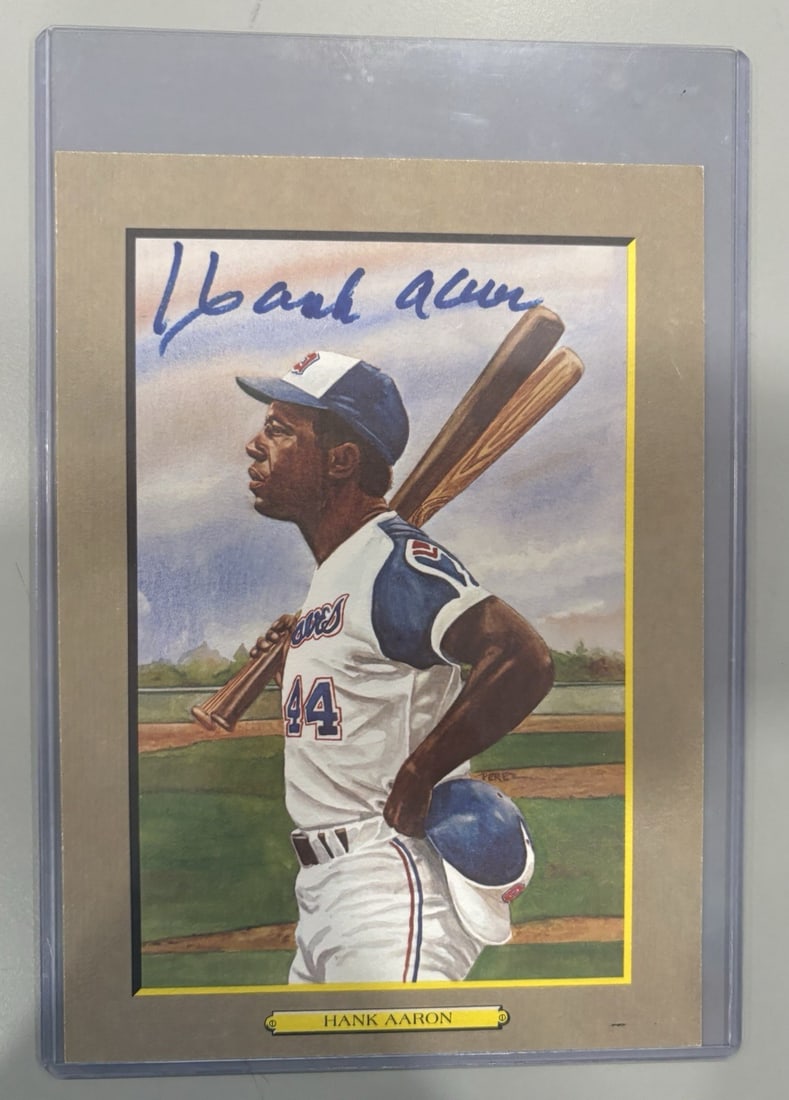 AARON HANK SIGNED AUTOGRAPH MOMENTS PEREZ-STEELE GREATEST JSA CERTIFIED: AARON HANK SIGNED AUTOGRAPH MOMENTS PEREZ-STEELE GREATEST JSA CERTIFIED Signed by baseball legend Hank Aaron, this postcard features a unique moment from his career. The item is certified by the Great