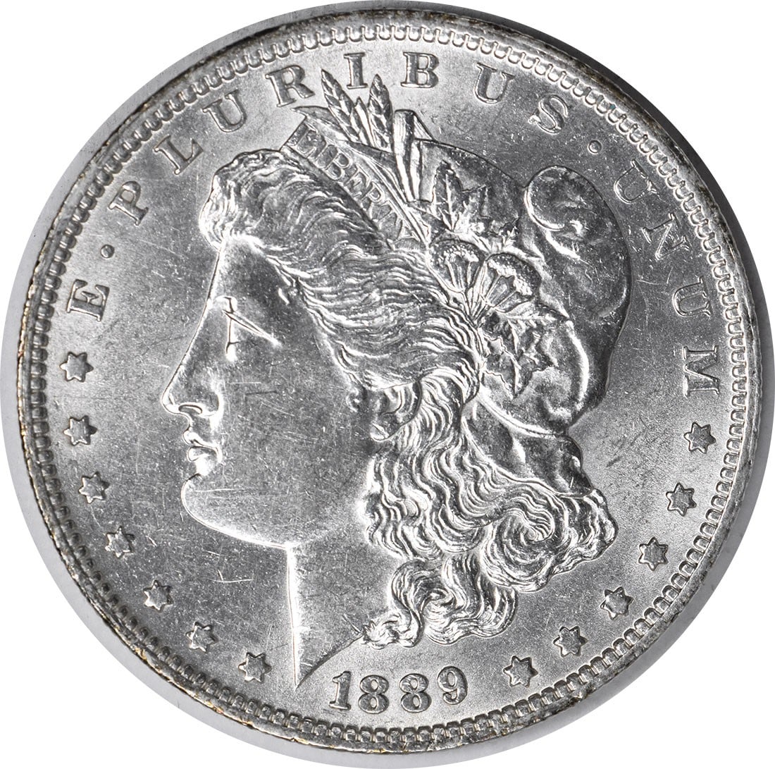 Morgan Silver Dollar AU Slider Uncertified 1889: Morgan Silver Dollar AU Slider Uncertified 1889 The 1889 Morgan Silver Dollar is a Circulated Uncirculated coin with a rich history, featuring a reeded edge and a distinctive mint mark. Made from 90% 