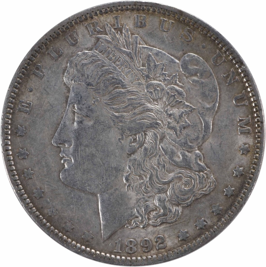Morgan Silver Dollar 1892 AU Uncertified: Morgan Silver Dollar 1892 AU Uncertified The 1892 Morgan Silver Dollar is a circulated coin with an attractive AU grade, showcasing its 90% silver and 10% copper composition. With its reeded edge and 