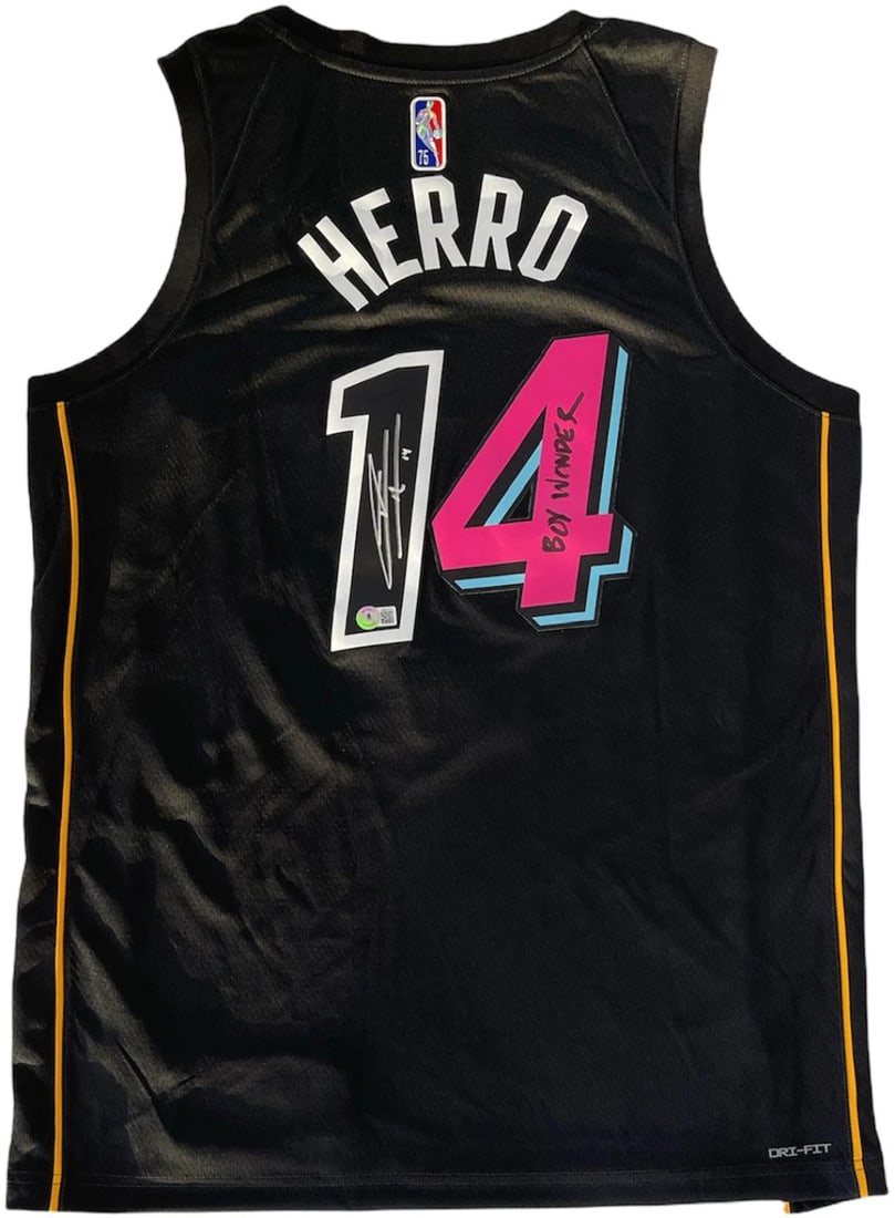 Tyler Herro Autographed Miami Heat Mashup Jersey (Beckett): Tyler Herro Autographed Miami Heat Mashup Jersey (Beckett) Signed in silver and black sharpie across the back of the jersey on the numbers with inscription "Boy Wonder", this Tyler Herro Autographed