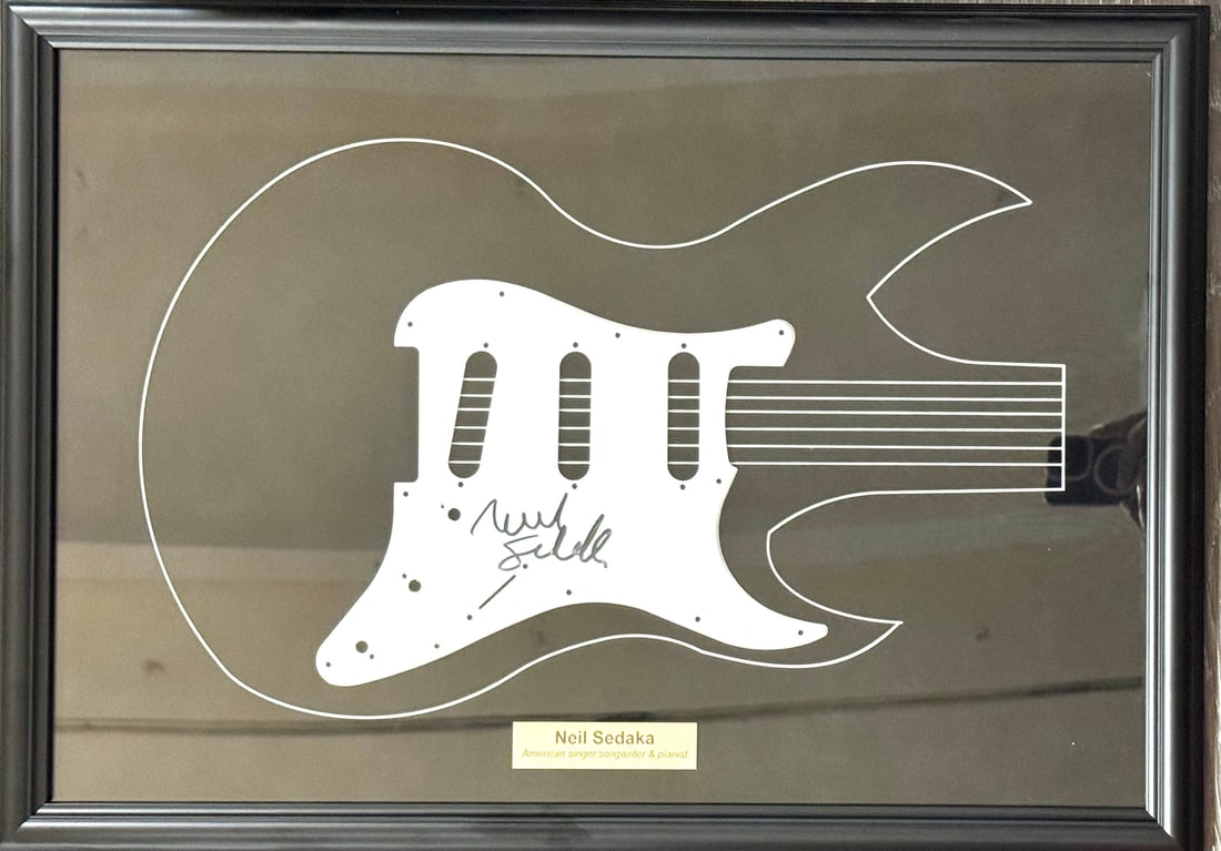 Framed guitar pickguard autographed by Neil Sedaka (1 of 3)