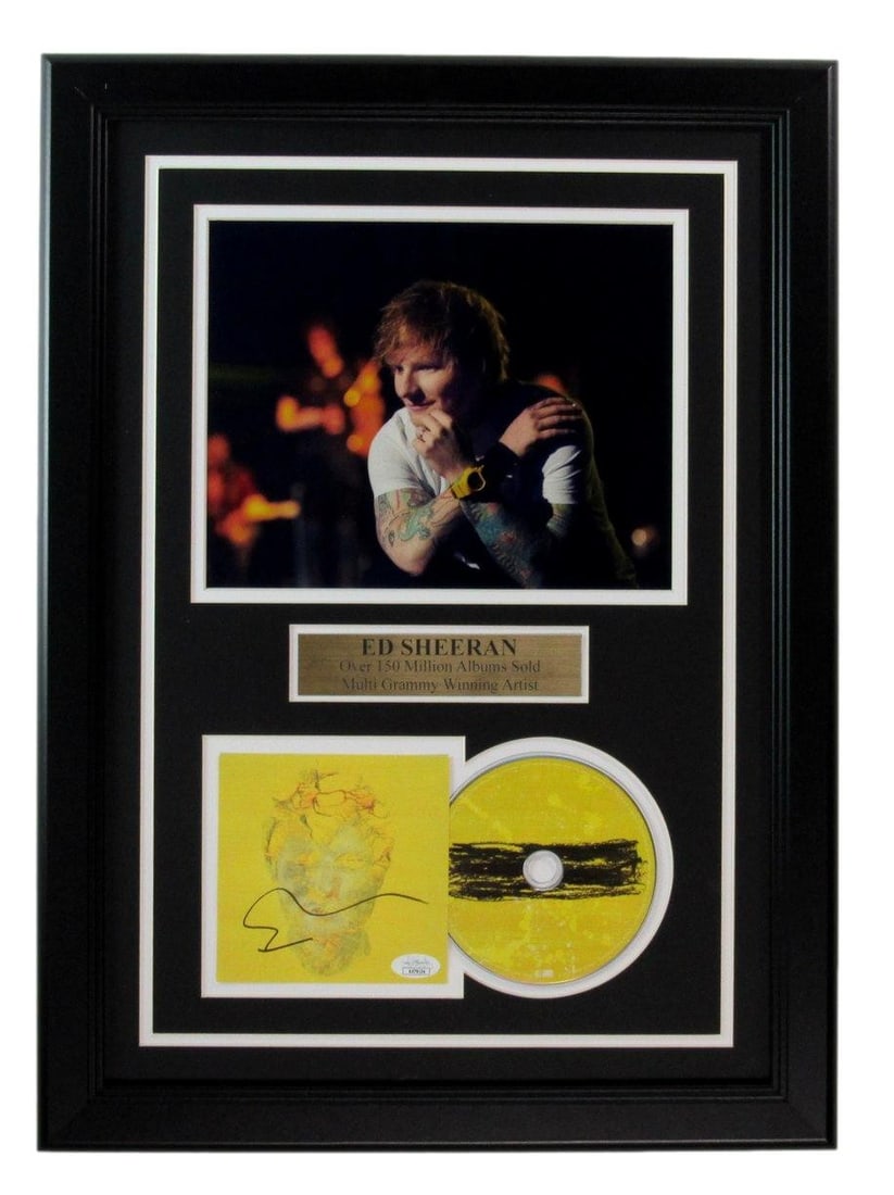 Ed Sheeran Autographed CD Cover Framed JSA Photo 8x10: Ed Sheeran Autographed CD Cover Framed JSA Photo 8x10 Ed Sheeran's 8x10 JSA photo is framed and displayed on a CD cover, showcasing the singer's unique style. This unique item bears a signature, a not
