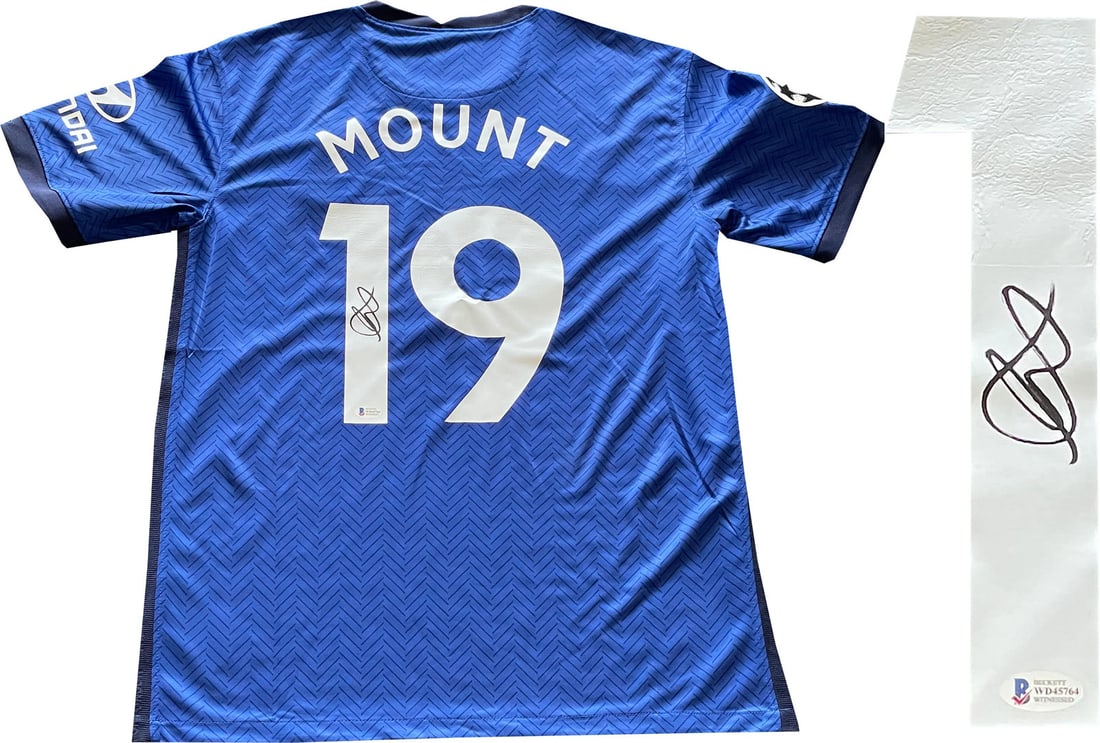 Mount Mason Autographed Home Chelsea Jersey: Mount Mason Autographed Home Chelsea Jersey Mason Mount's sharpie signature on the back of this Chelsea home jersey adds a unique touch to any sports memorabilia collection. The jersey's authenticity 