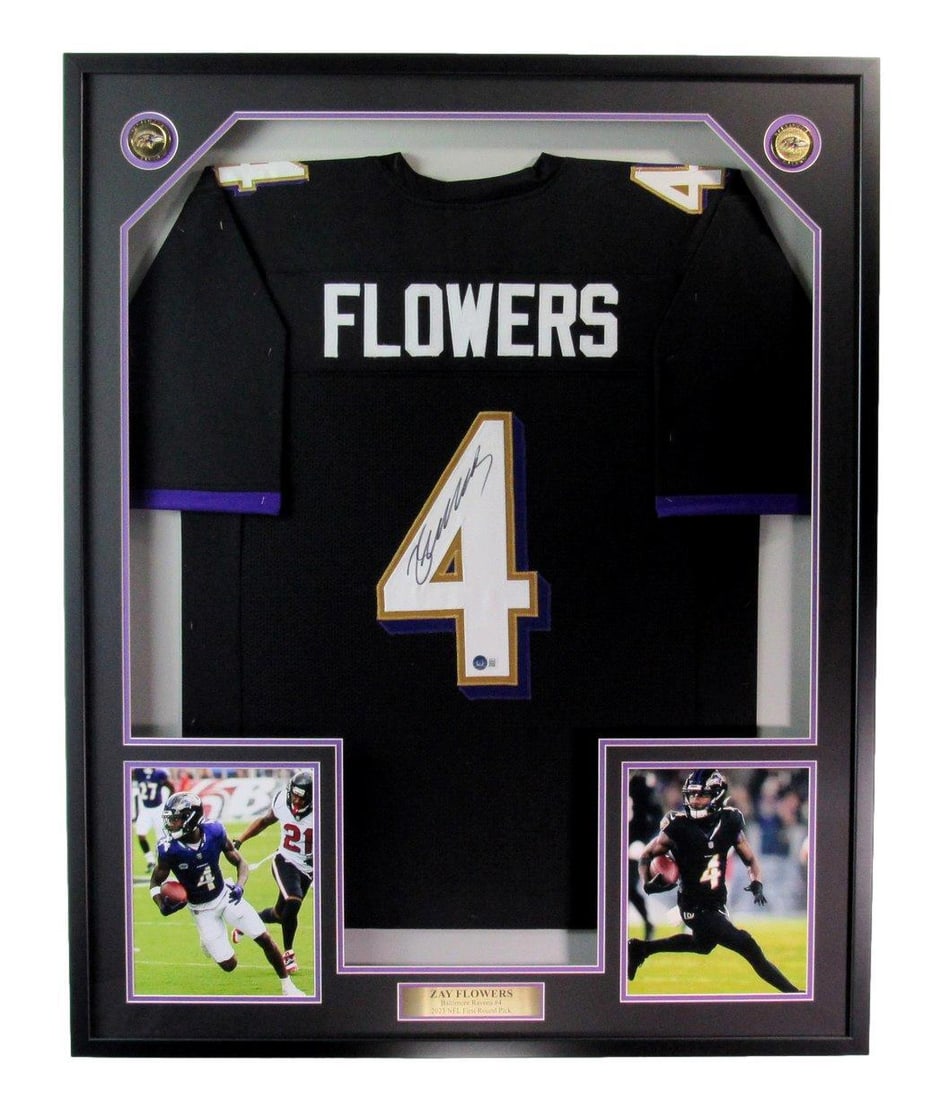 Black Football Jersey Autographed Ravens Framed Beckett Flowers Zay 186186: Black Football Jersey Autographed Ravens Framed Beckett Flowers Zay 186186 This black football jersey has been autographed by Zay, and comes framed in a Beckett Flowers display case. The jersey itself