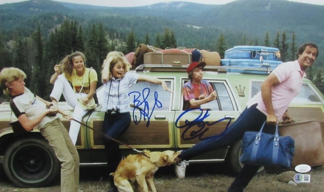 Chevy Chase/ Beverly D'Angelo Dual-Signd 12x20 Photo "Family Vacation" JSA 191288: Chevy Chase/ Beverly D'Angelo Dual-Signd 12x20 Photo "Family Vacation" JSA 191288 Chevy Chase and Beverly D'Angelo's iconic "Family Vacation" photo, signed by both stars, is a unique piece of movie hi