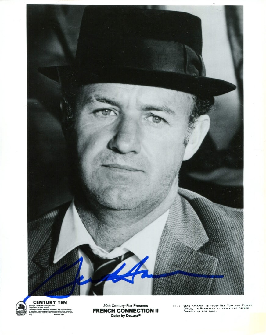 Gene Hackman Autographed 8x10 Photo: Gene Hackman Autographed 8x10 Photo Gene Hackman's iconic presence is captured in this 8x10 photo, signed in blue sharpie across the front. The image bears the signature of the legendary actor,