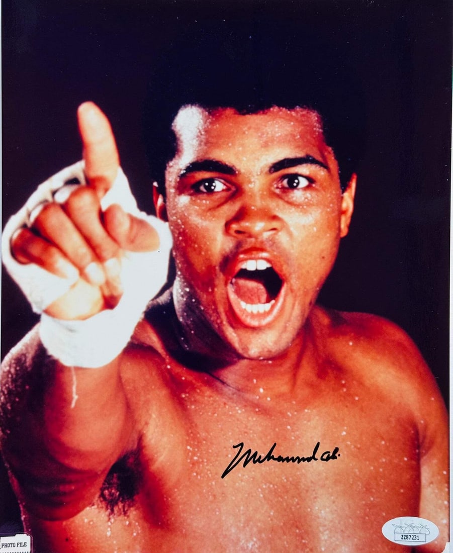 Muhammad Ali Autographed Framed Photo 8x10 JSA: Muhammad Ali Autographed Framed Photo 8x10 JSA Authentic 8x10 photo of Muhammad Ali signed in black sharpie across the front, verified by James Spence Authentication (JSA). This framed photo showcases