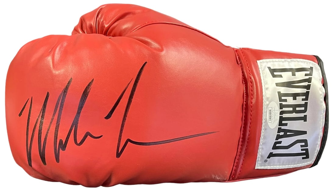 Mike Tyson Glove Autographed Red Everlast Left: Mike Tyson Glove Autographed Red Everlast Left Authentic Mike Tyson Glove Signed in Black Sharpie. This James Spence Authentication (JSA) certified boxing glove features a bold, black signature across