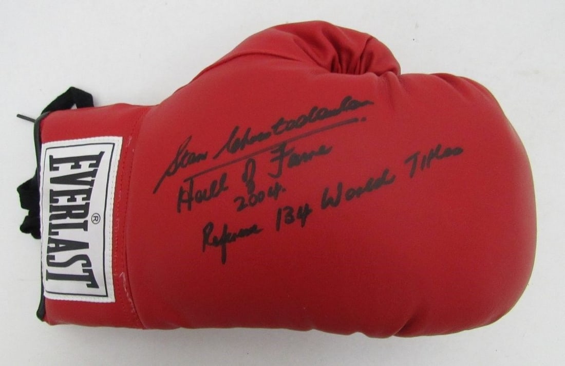 Referee Christodoulou Signed Boxing Glove HOF Everlast JSA: Referee Christodoulou Signed Boxing Glove HOF Everlast JSA Signed by legendary boxer Christodoulou, this official Everlast boxing glove is a unique piece of sports memorabilia, boasting the distinctiv