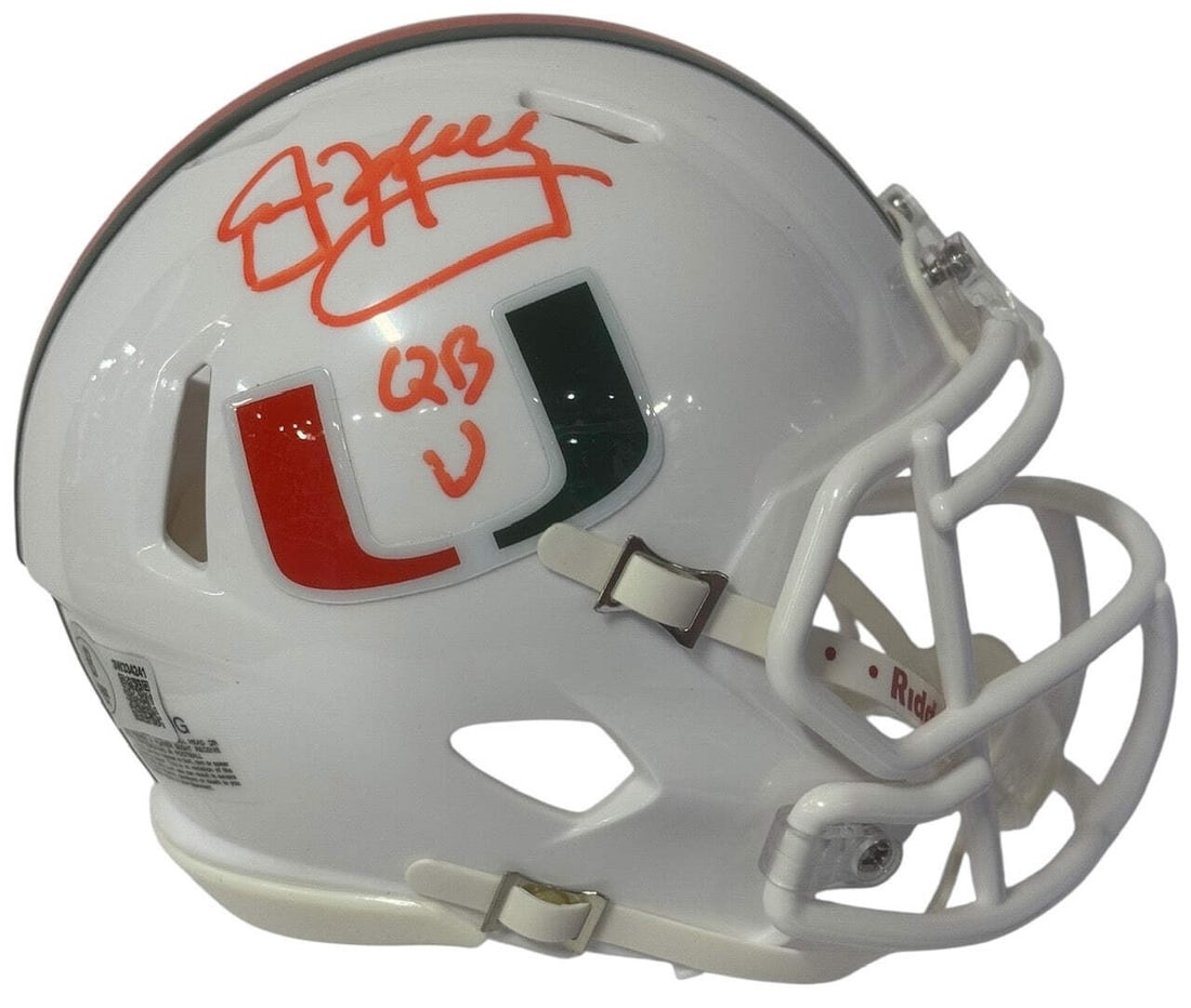 Jim Kelly Autographed Hurricanes Mini Helmet (Beckett Witness): Jim Kelly Autographed Hurricanes Mini Helmet (Beckett Witness) Signed in orange paint pen across the side of the helmet with inscription "QB U", this Jim Kelly Autographed Hurricanes Mini Helmet