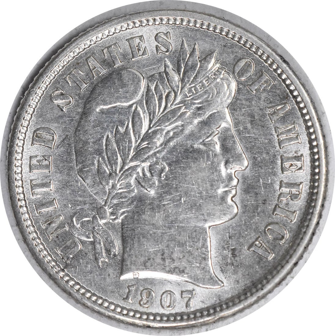 Silver Dime Barber 1907 AU Uncertified Slider: Silver Dime Barber 1907 AU Uncertified Slider The 1907 Barber dime is a significant piece of American numismatic history, featuring the iconic design of Charles E. Barber. This circulated coin, certif